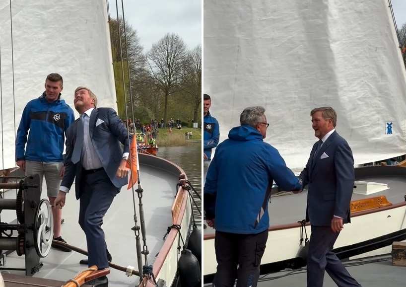 Крал Вилем-Александър на платноходка и внимателно разглежда детайлите по нея.